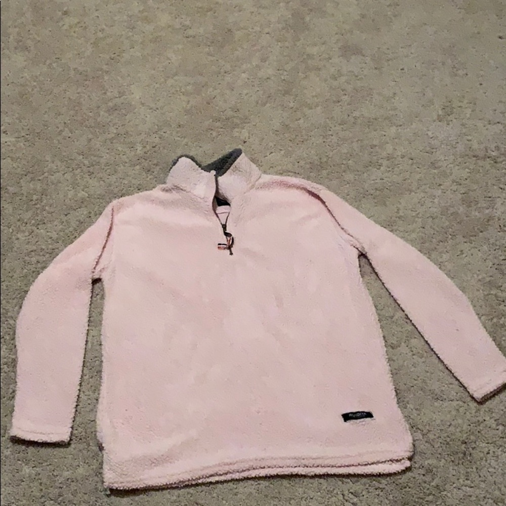 A fuzzy pink pullover